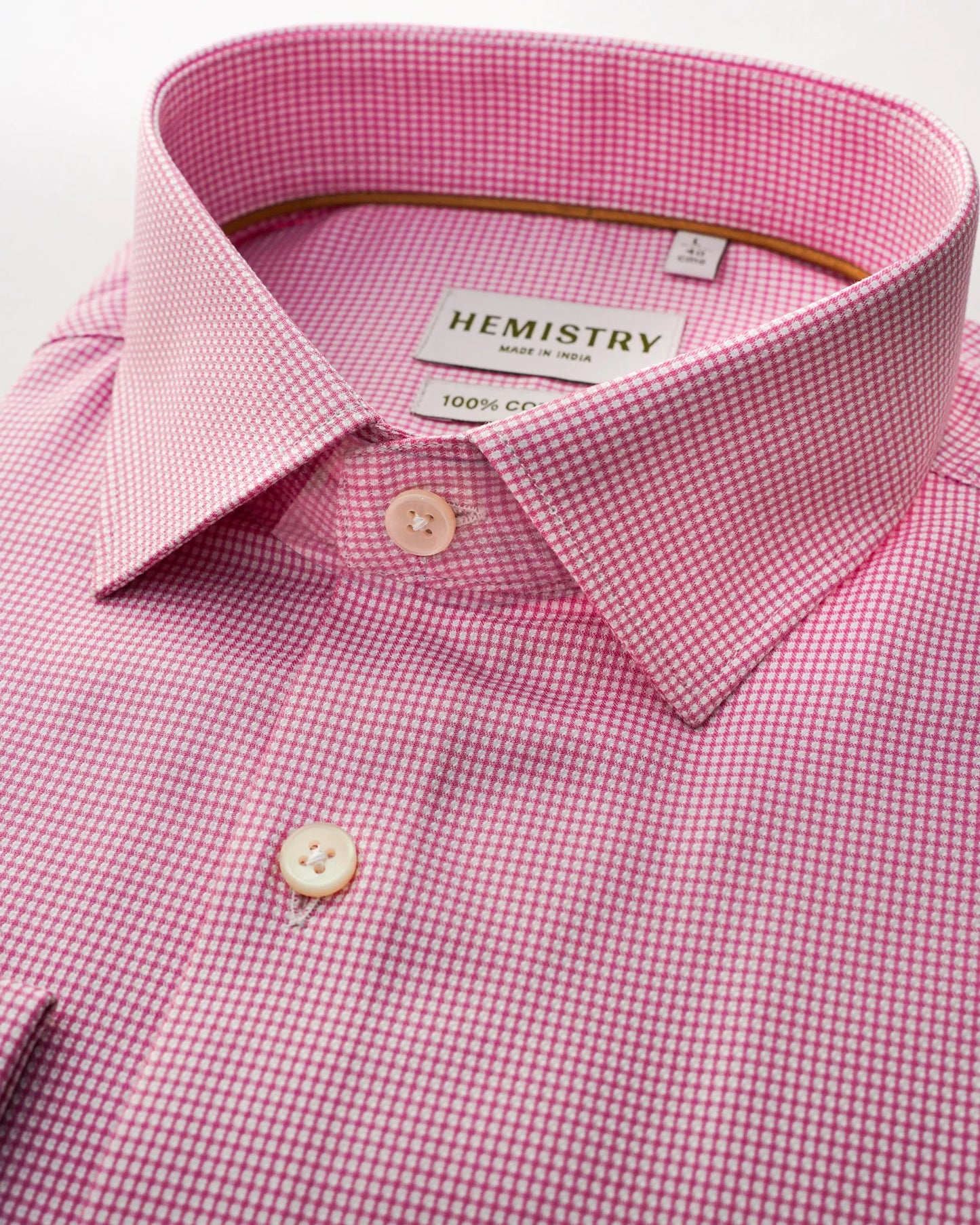 Closeup of pink micro check shirt showcasing crisp collar